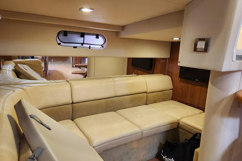 Slide: The Image of Interior of 2015 Formula 34 Performance Cruiser with beige leather seating and wood accents. - 75