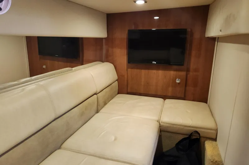Slide: The Image of Interior of 2015 Formula 34 Performance Cruiser with beige seating and wall-mounted TV. - 76