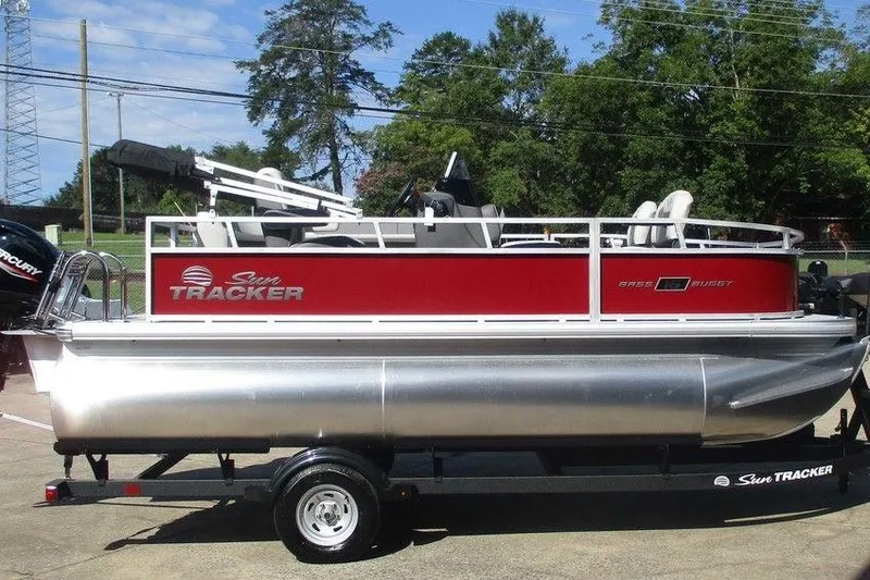 Slide: The Image of 2026 Sun Tracker Bass Buggy® 16 XL Select pontoon boat on trailer, red and silver design. - 4