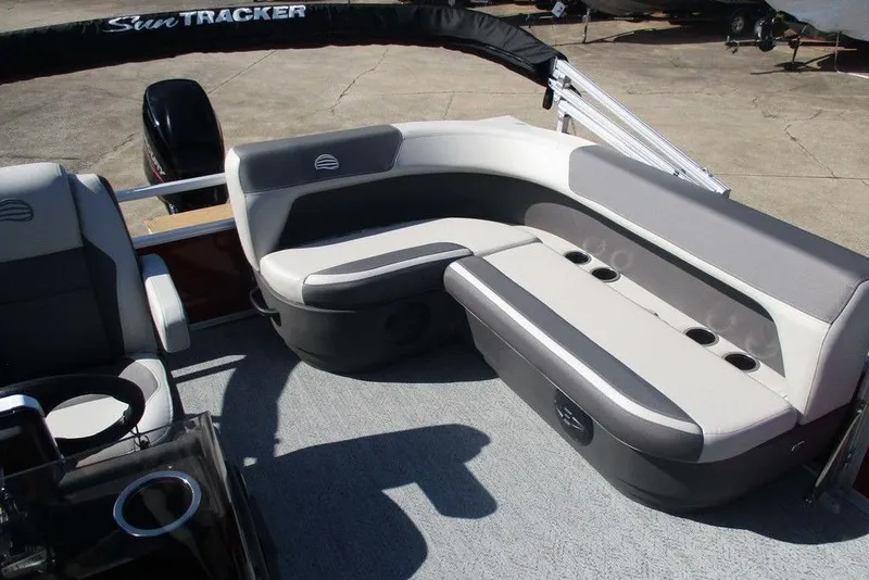 Slide: The Image of 2026 Sun Tracker Bass Buggy® 16 XL Select pontoon boat interior with cushioned seating. - 6