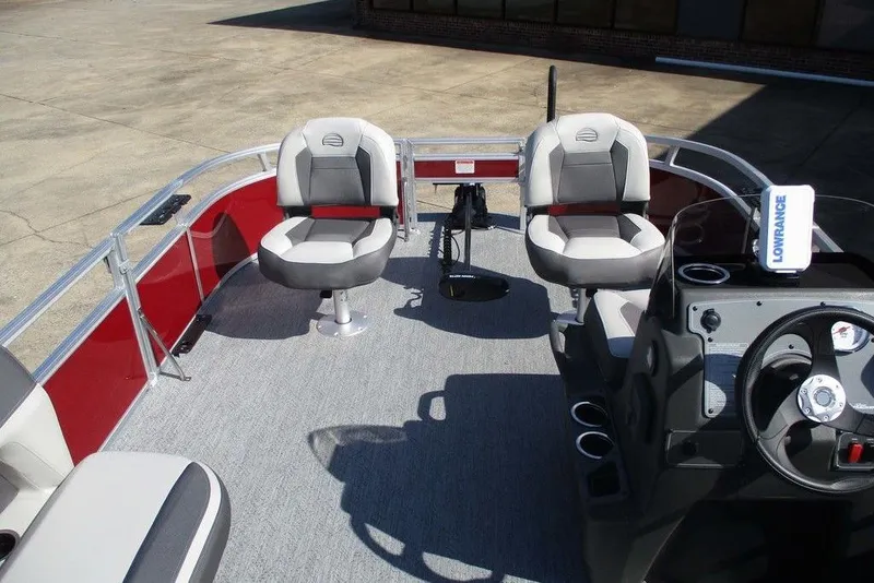 Slide: The Image of 2026 Sun Tracker Bass Buggy® 16 XL Select pontoon boat interior with seating and steering console. - 8