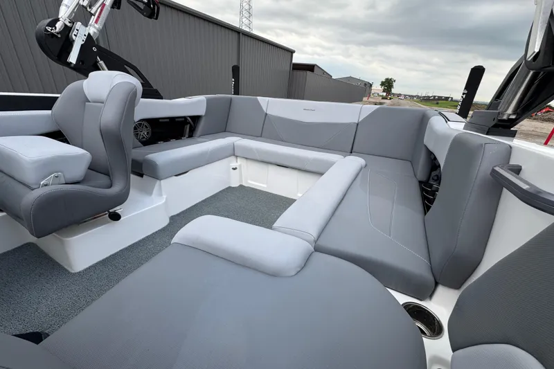 Slide: The Image of 2022 MasterCraft NXT20 boat interior with gray seating and modern design. - 15