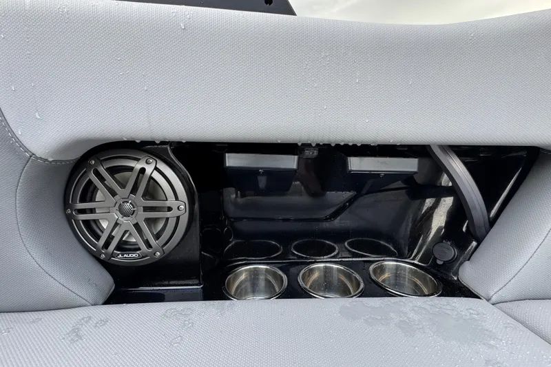 Slide: The Image of 2022 MasterCraft NXT20 boat interior with JL Audio speaker and cup holders. - 16