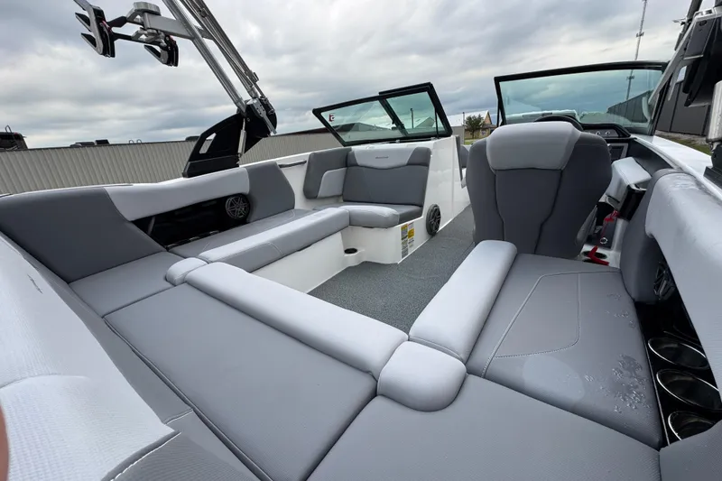Slide: The Image of 2022 MasterCraft NXT20 boat interior with gray seating and modern design. - 17