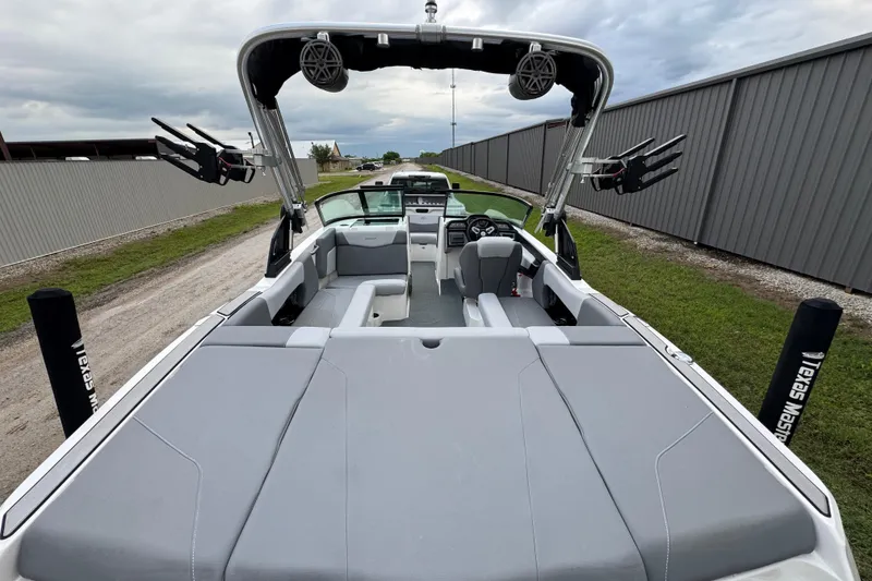 Slide: The Image of 2022 MasterCraft NXT20 boat with sleek interior and advanced wakeboard tower. - 19