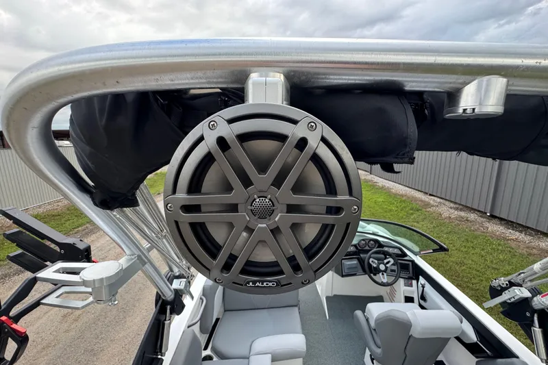 Slide: The Image of 2022 MasterCraft NXT20 boat with JL Audio speaker and sleek interior design. - 21