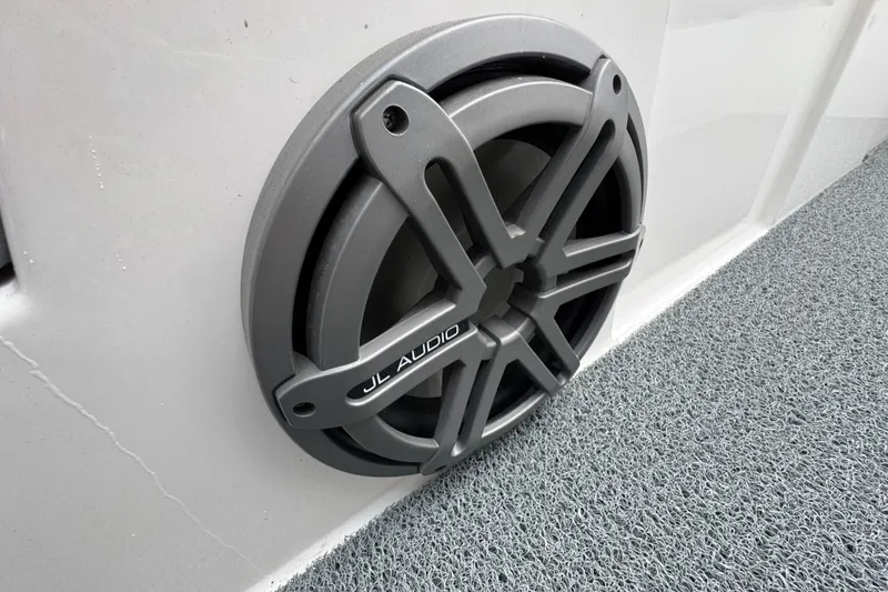 Slide: The Image of JL Audio speaker in 2022 MasterCraft NXT20 boat, mounted on textured surface. - 23