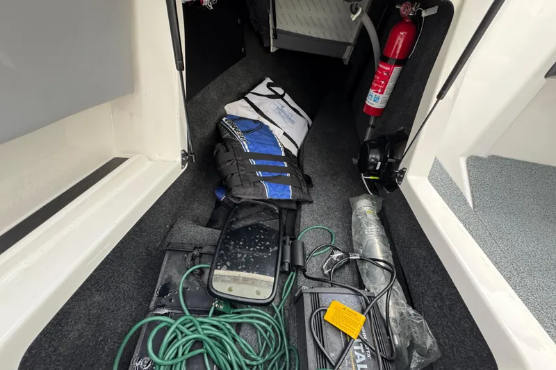 Slide: The Image of Interior of 2022 MasterCraft NXT20 boat with safety gear and equipment. - 24
