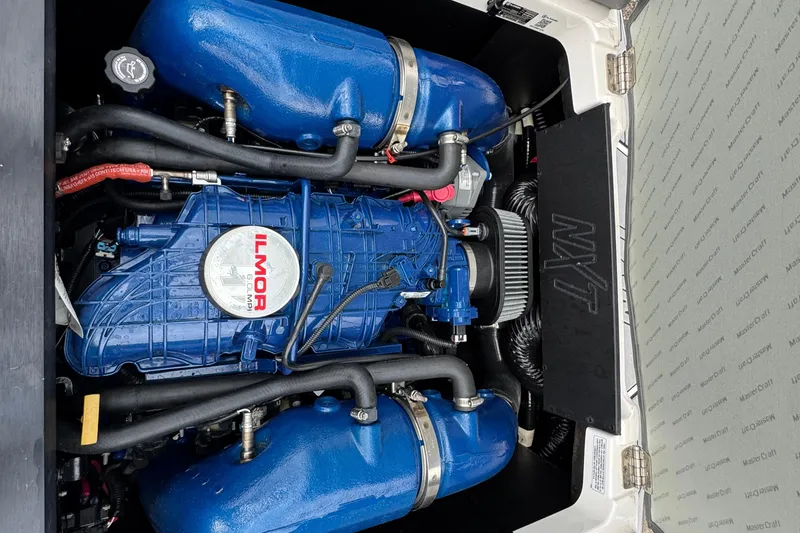Slide: The Image of 2022 MasterCraft NXT20 engine compartment featuring Ilmor marine engine. - 25