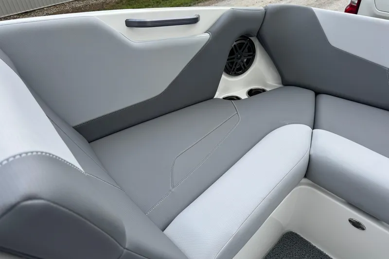 Slide: The Image of Interior seating of 2022 MasterCraft NXT20 boat with gray upholstery and speaker. - 9