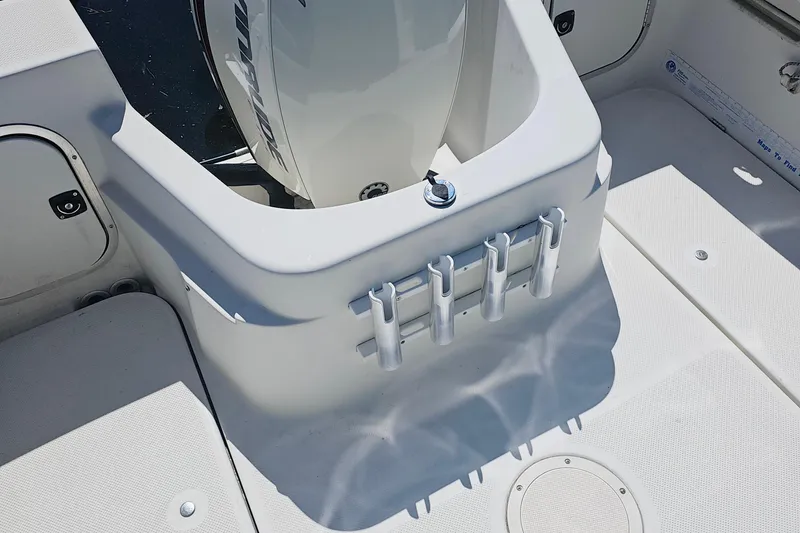 Slide: The Image of Bayliner 2000 Trophy boat interior with rod holders and engine mount. - 3
