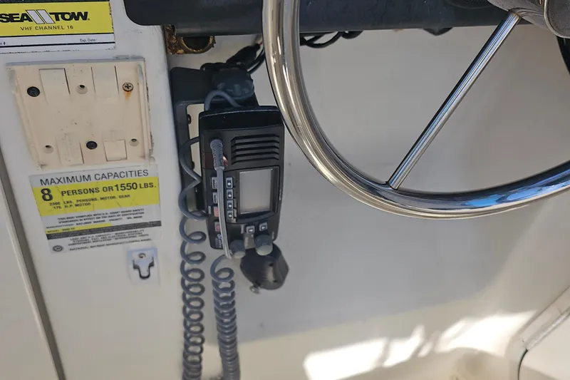 Slide: The Image of Steering wheel and radio on 2000 Bayliner Trophy boat, capacity for 8 people. - 6