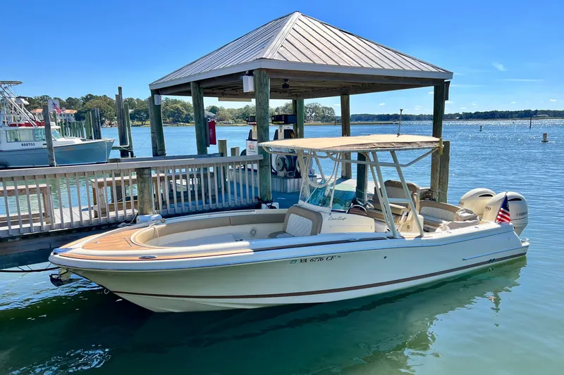 The Image of 2015 Chris-Craft Catalina 26 docked by a wooden pier on a sunny day. - 0