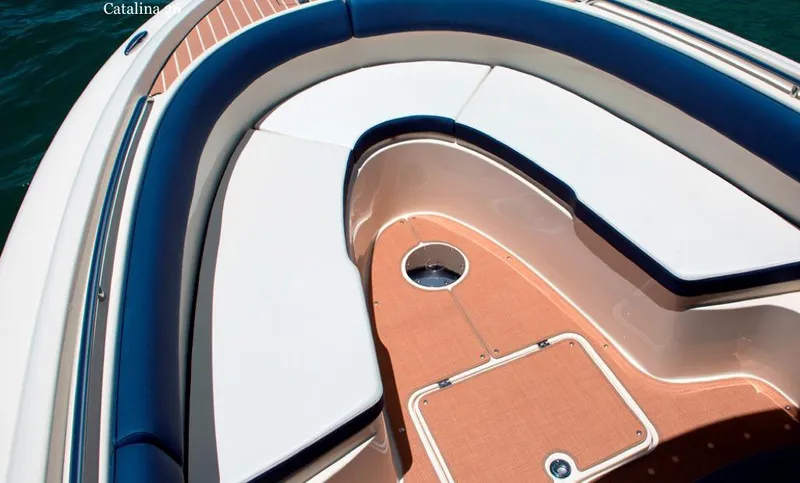 Slide: The Image of Manufacturer Provided Image: 2015 Chris-Craft Catalina 26 boat interior with cushioned seating and teak flooring. - 10