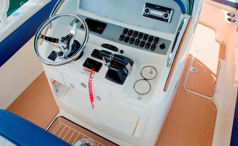 Slide: The Image of Manufacturer Provided Image: 2015 Chris-Craft Catalina 26 helm station with steering wheel and control panel. - 11