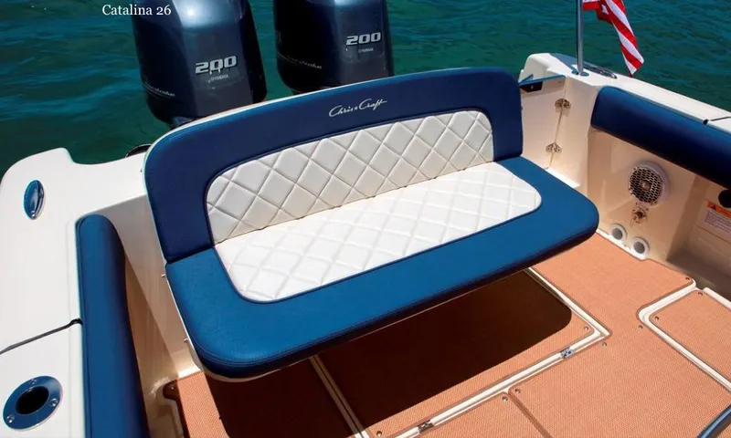 Slide: The Image of Manufacturer Provided Image: 2015 Chris-Craft Catalina 26 boat interior with cushioned seating and twin 200 HP engines. - 12