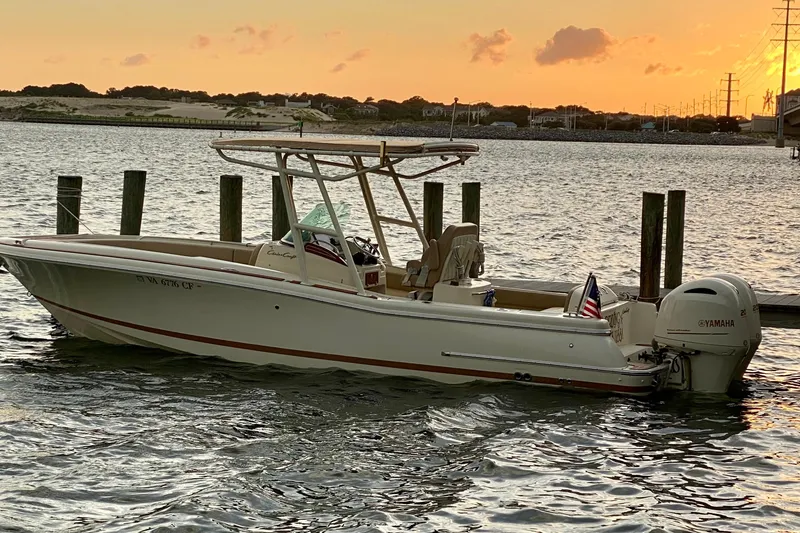 Slide: The Image of 2015 Chris-Craft Catalina 26 boat docked at sunset with Yamaha engine. - 4