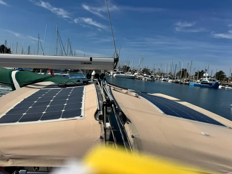 Slide: The Image of Sailboat with solar panels docked in marina, Marlow-Hunter 31, 2016 model. - 13