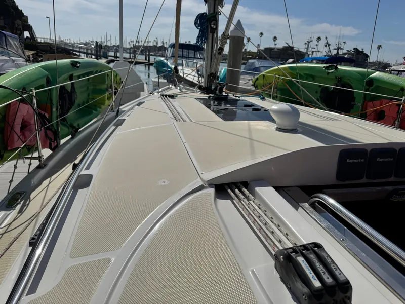 Slide: The Image of 2016 Marlow-Hunter 31 sailboat deck with kayaks, docked at marina. - 14
