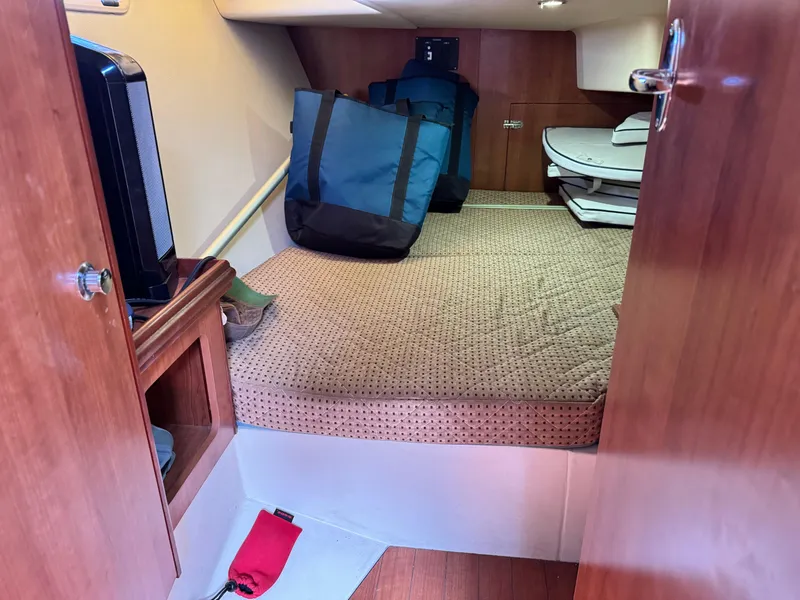 Slide: The Image of Cabin interior of 2016 Marlow-Hunter 31 sailboat with bed and storage. - 19