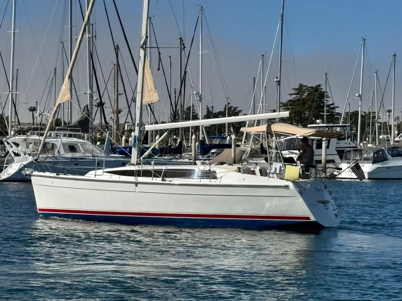 Slide: The Image of 2016 Marlow-Hunter 31 sailboat docked in a marina with other boats. - 23
