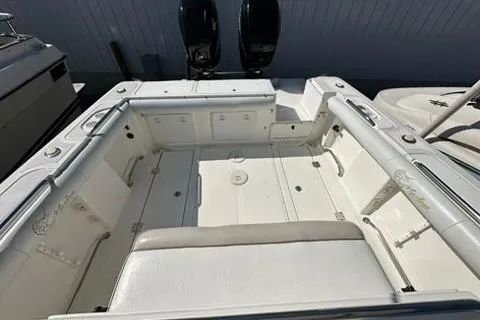 Slide: The Image of 2005 Marlago 35 SS boat interior with spacious seating and dual engines. - 10