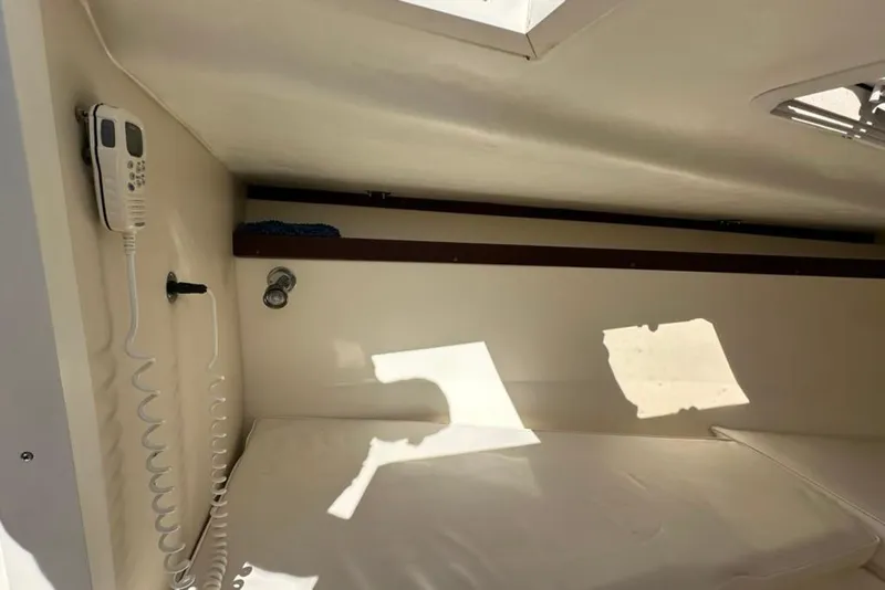 Slide: The Image of Interior cabin of 2005 Marlago 35 SS boat with communication device and sunlight. - 22