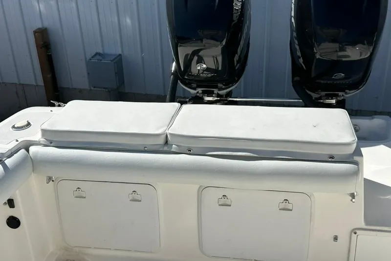 Slide: The Image of 2005 Marlago 35 SS boat with dual Mercury outboard engines and cushioned seating. - 24