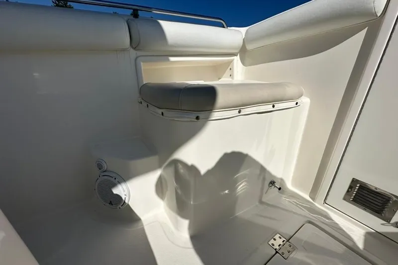 Slide: The Image of 2005 Marlago 35 SS boat interior with cushioned seating and speaker. - 27