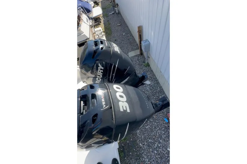 Slide: The Image of Twin Mercury Verado 300 engines on a 2005 Marlago 35 SS boat. - 29