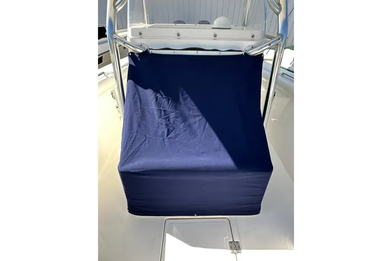 Slide: The Image of 2005 Marlago 35 SS boat with blue cover on console, stainless steel frame visible. - 33