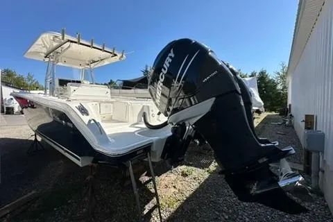 Slide: The Image of 2005 Marlago 35 SS boat with Mercury outboard engine, docked outdoors. - 4