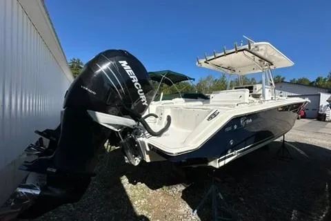Slide: The Image of 2005 Marlago 35 SS boat with Mercury outboard engine, docked outdoors. - 5