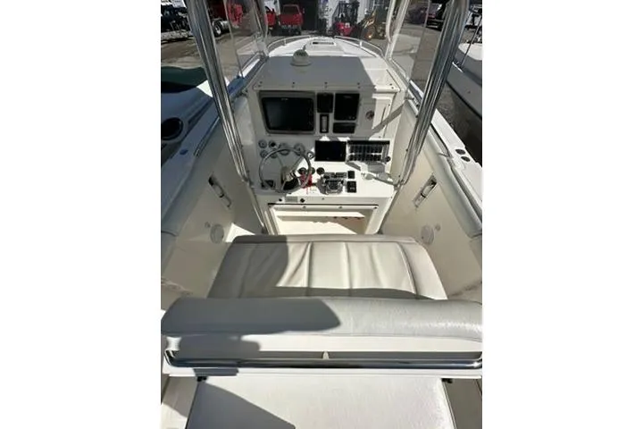 Slide: The Image of 2005 Marlago 35 SS boat cockpit with steering controls and navigation equipment. - 7