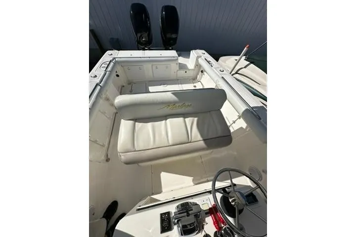 Slide: The Image of 2005 Marlago 35 SS boat interior with seating and controls. - 9