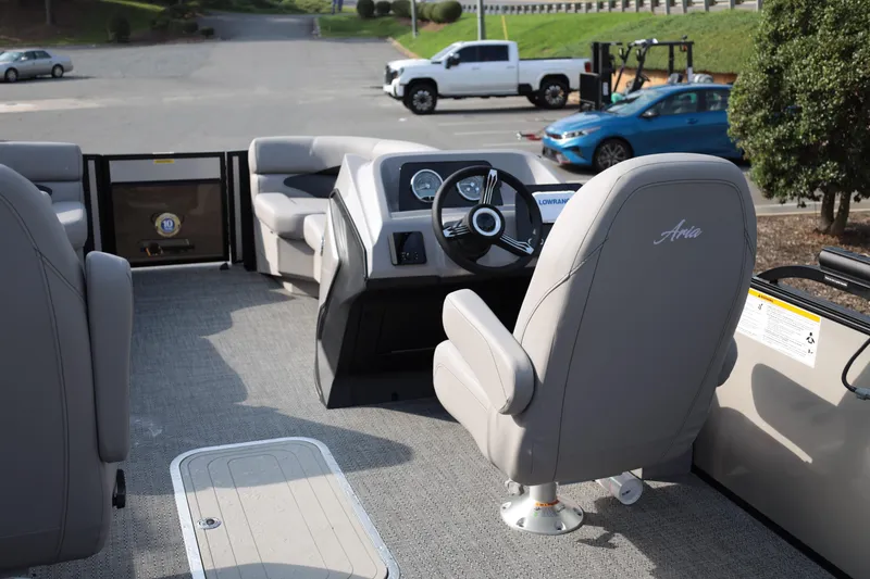 Slide: The Image of 2026 Barletta ARIA 22UC pontoon boat interior with steering console and seating. - 12
