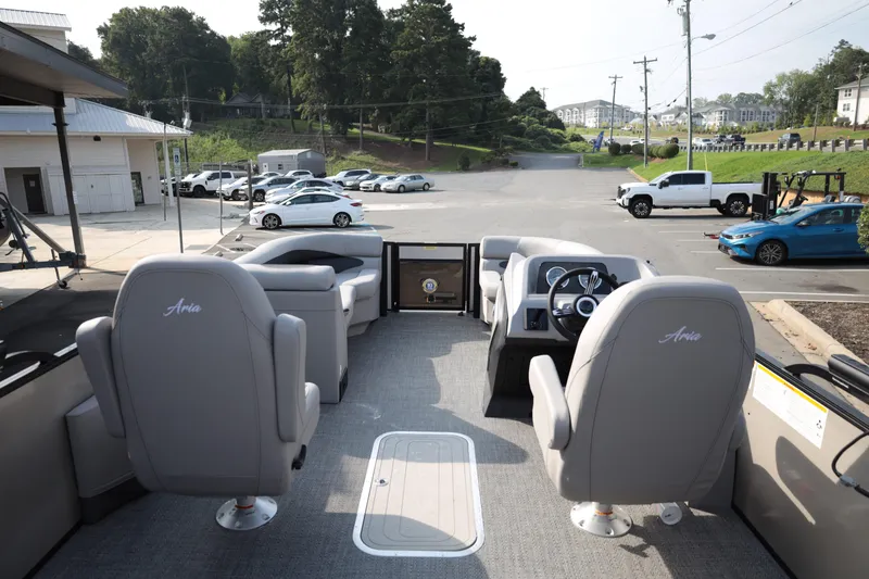 Slide: The Image of 2026 Barletta ARIA 22UC pontoon boat interior with gray seating and steering console. - 13