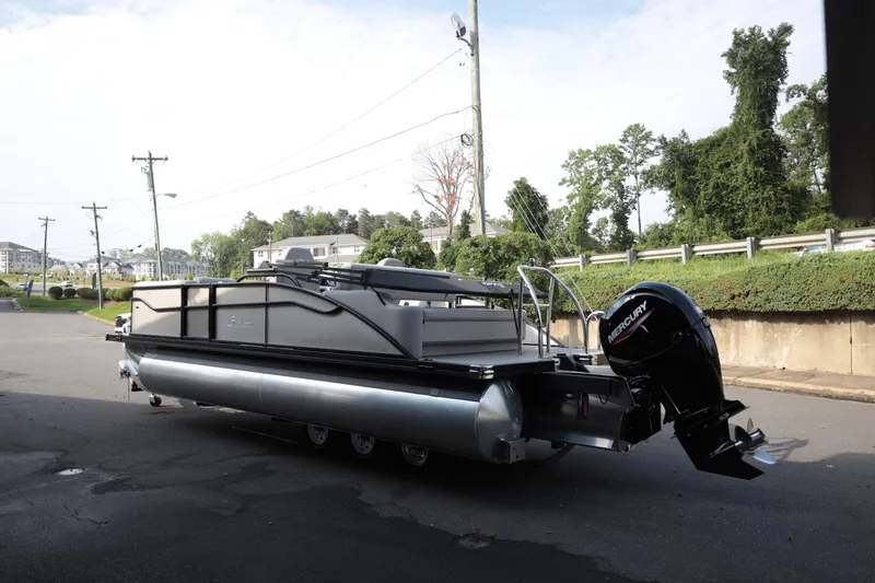 Slide: The Image of 2026 Barletta ARIA 22UC pontoon boat with Mercury outboard motor on a street. - 4