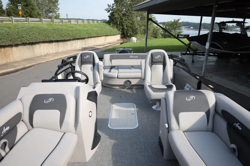 Slide: The Image of 2026 Barletta ARIA 22UC pontoon boat interior with plush seating and modern design. - 7
