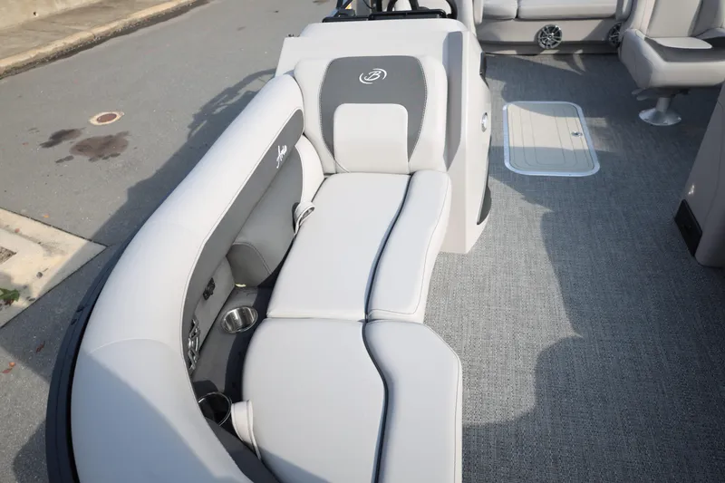 Slide: The Image of 2026 Barletta ARIA 22UC boat interior with gray seating and cup holders. - 9