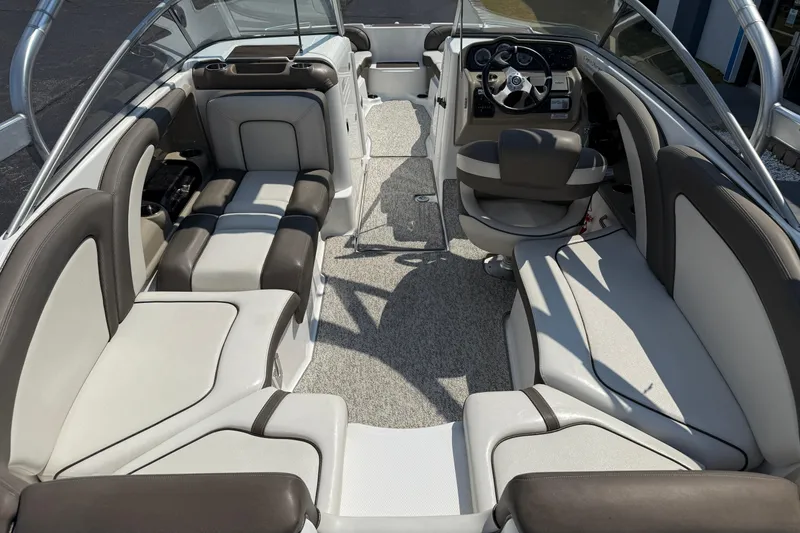 Slide: The Image of 2012 Yamaha Boats 242 Limited S interior with spacious seating and modern dashboard. - 12
