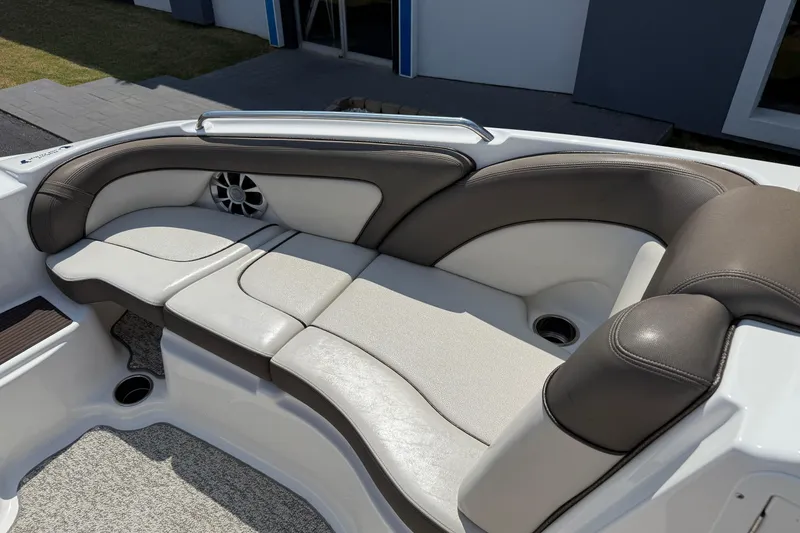 Slide: The Image of 2012 Yamaha Boats 242 Limited S interior seating with cushioned upholstery and speaker. - 16