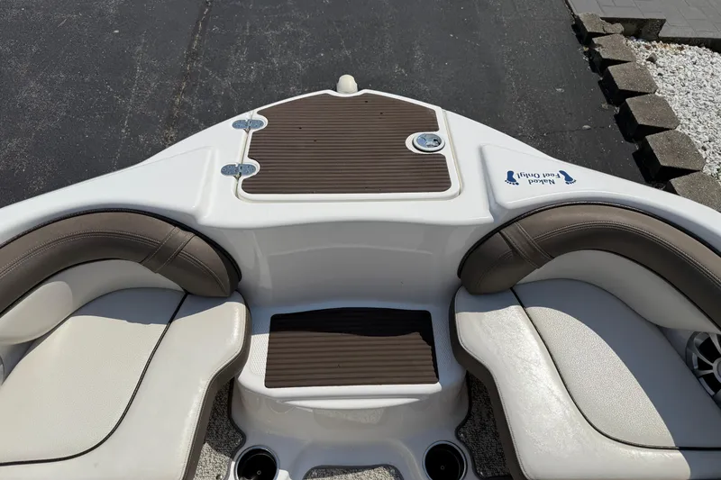 Slide: The Image of 2012 Yamaha Boats 242 Limited S interior seating with brown and white upholstery. - 18