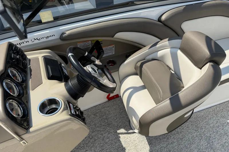 Slide: The Image of 2012 Yamaha Boats 242 Limited S cockpit with steering wheel and comfortable seating. - 21