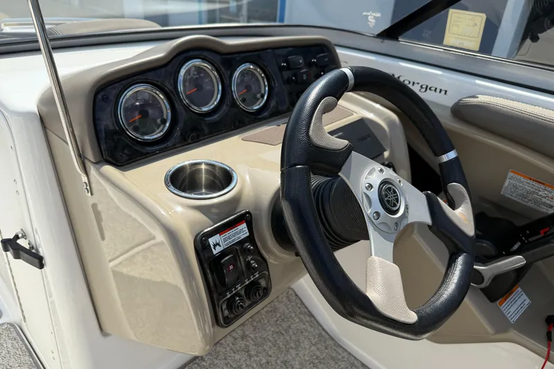 Slide: The Image of 2012 Yamaha Boats 242 Limited S dashboard with steering wheel and gauges. - 24