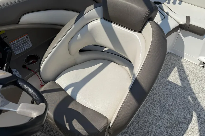 Slide: The Image of Captain's seat of 2012 Yamaha Boats 242 Limited S, featuring sleek design and comfortable upholstery. - 27