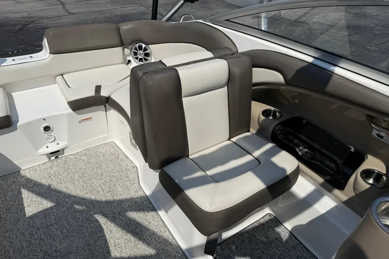 Slide: The Image of 2012 Yamaha Boats 242 Limited S interior seating with cup holders and speaker. - 29