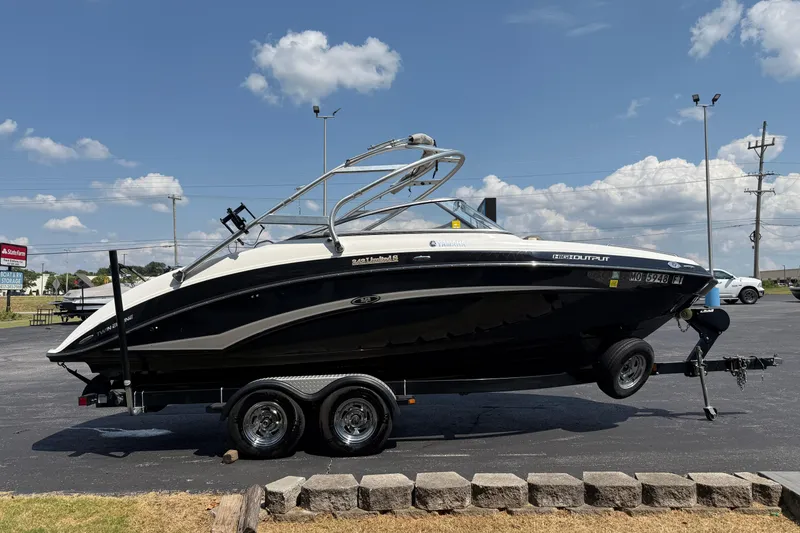 Slide: The Image of 2012 Yamaha Boats 242 Limited S on trailer under clear sky. - 7