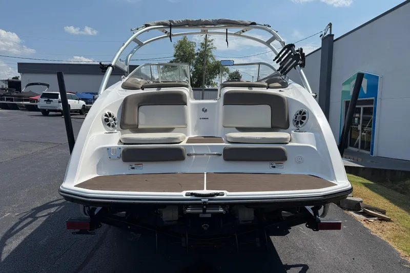 Slide: The Image of 2012 Yamaha Boats 242 Limited S, rear view, showcasing seating and swim platform. - 9