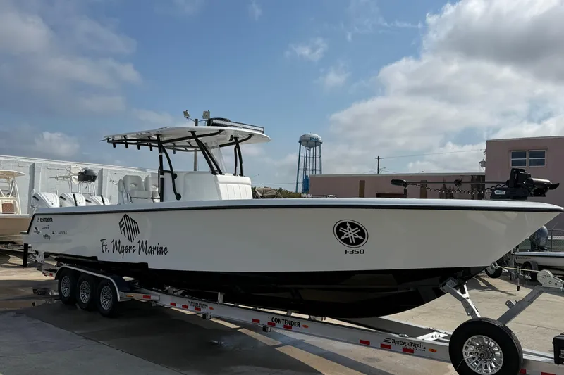 The Image of 2026 Contender 39 ST boat on trailer at Ft. Myers Marine under a cloudy sky. - 0